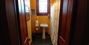Combined shower/tub, hair dryer, towels, soap