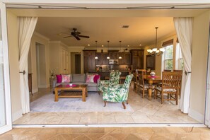 living room with opened up glass doors