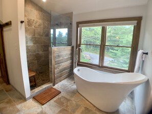 Bathtub, hair dryer, towels, soap