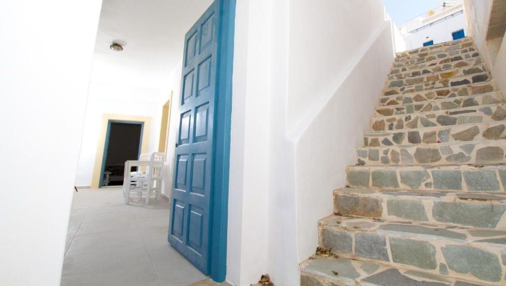 An external staircase leading to a lower floor entrance.