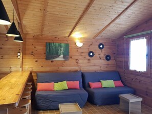 Luxury Chalet, 1 Bedroom, Non Smoking, Sea View | Living area