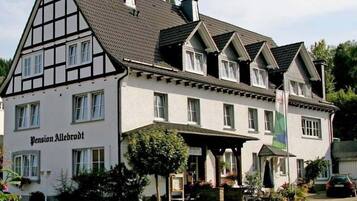 A traditional building with a sign reading "Pension Allebroidt".