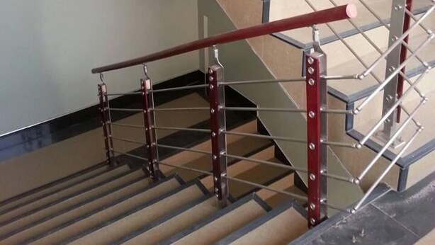 A staircase with metal railings and beige steps. - MJ Appartments (Accra)