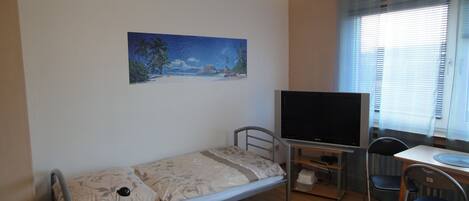 Deluxe appartement, balkon | 4 slaapkamers, een bureau, verduisterende gordijnen, gratis wifi