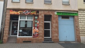 A building with multiple windows and a storefront.