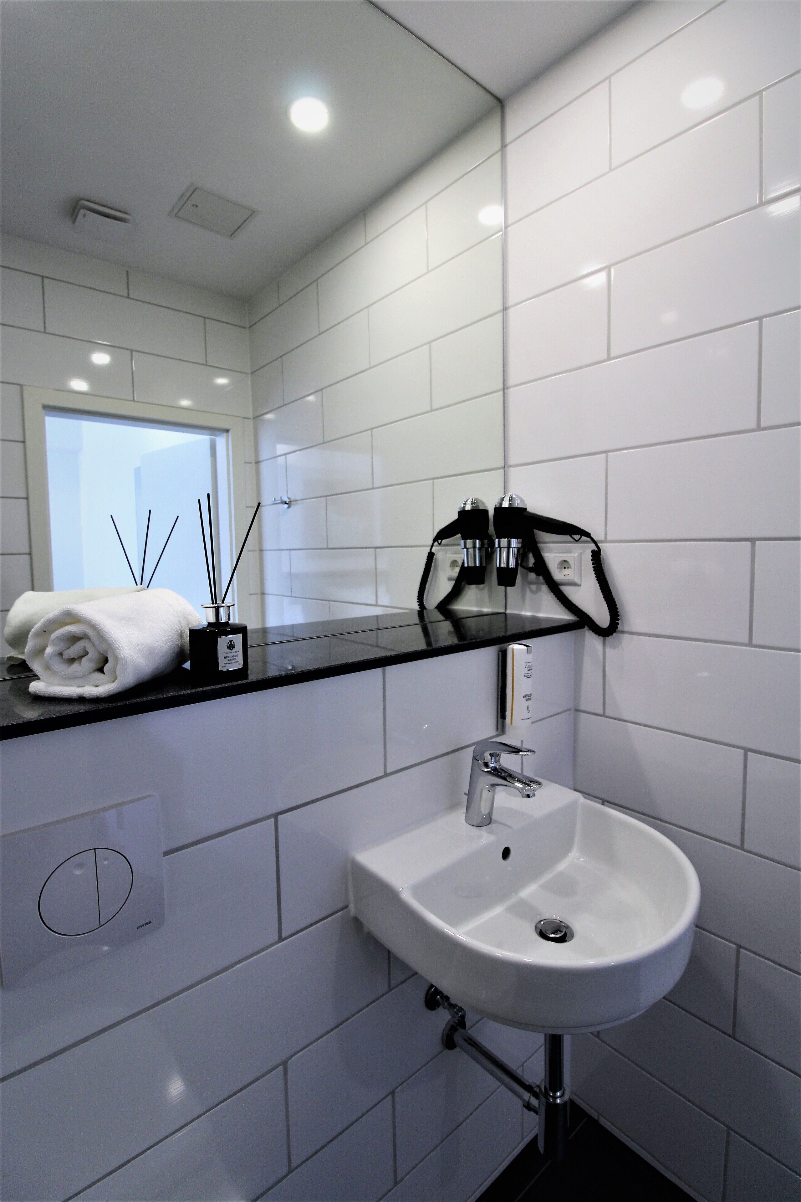 shower, rainfall showerhead, hair dryer, towels