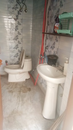 Bathroom. semi furnished Flat For Rent with one queen size bed and 4 chairs dining table