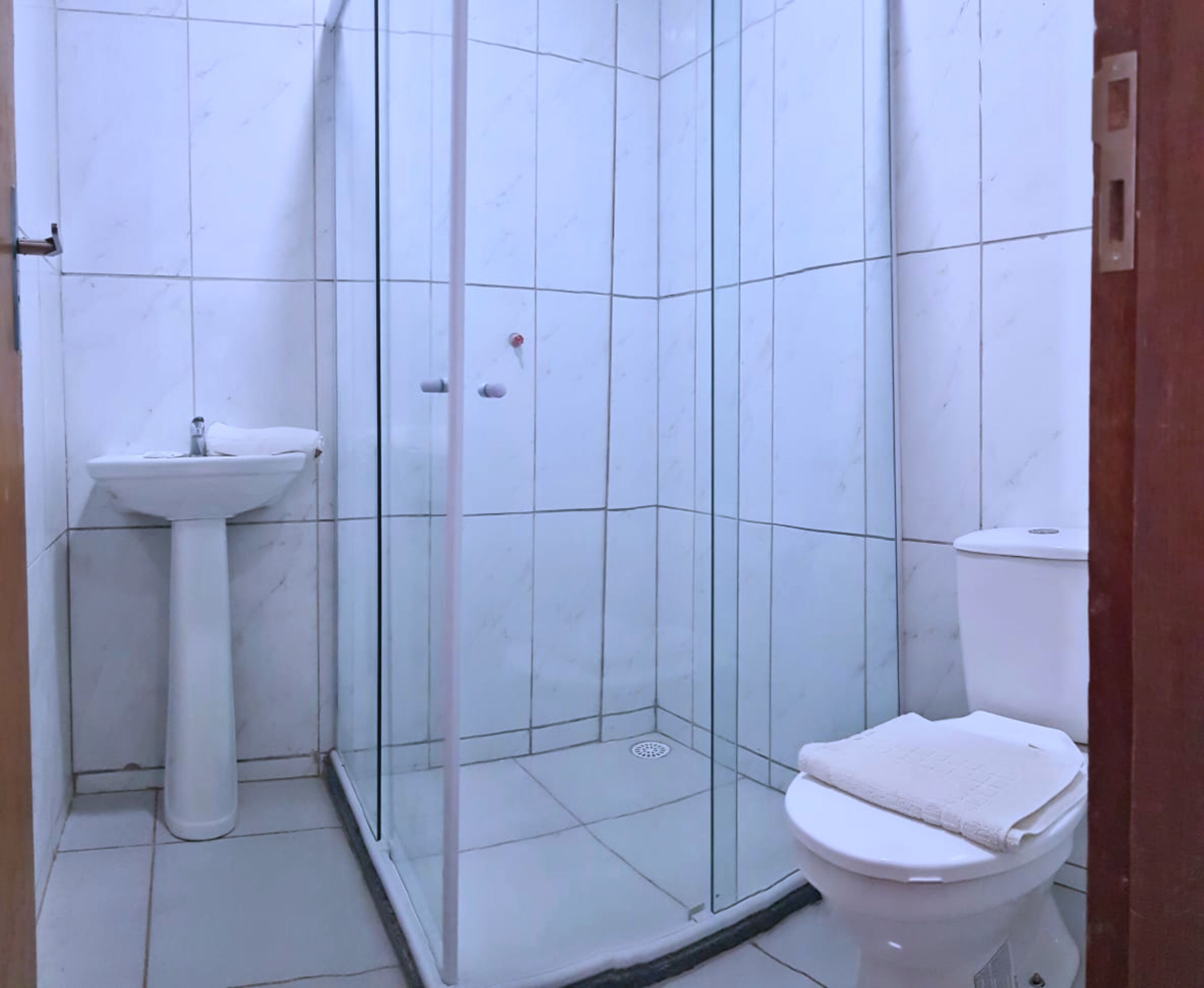 shower, rainfall showerhead, hair dryer, towels