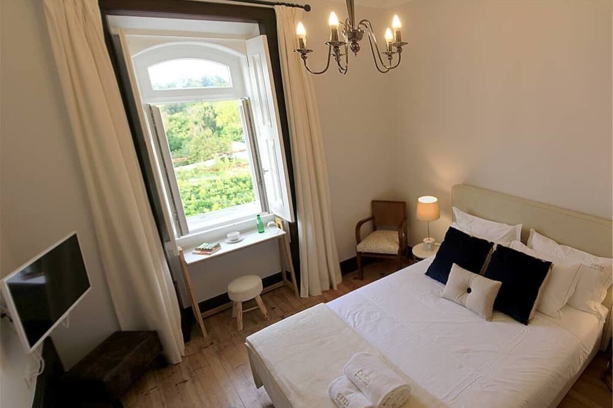 Habitación doble, vista al jardín | Cunas gratuitas, camas extra, wifi gratis y ropa de cama