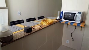 Fridge, microwave, stovetop, cookware/dishes/utensils