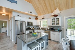 Microwave, dishwasher, coffee/tea maker, dining tables