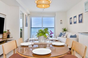 Luxury Apartment | Living area | Flat-screen TV - Surfside Beachfront Suites by Playa Caracol Resorts (Punta Chame)