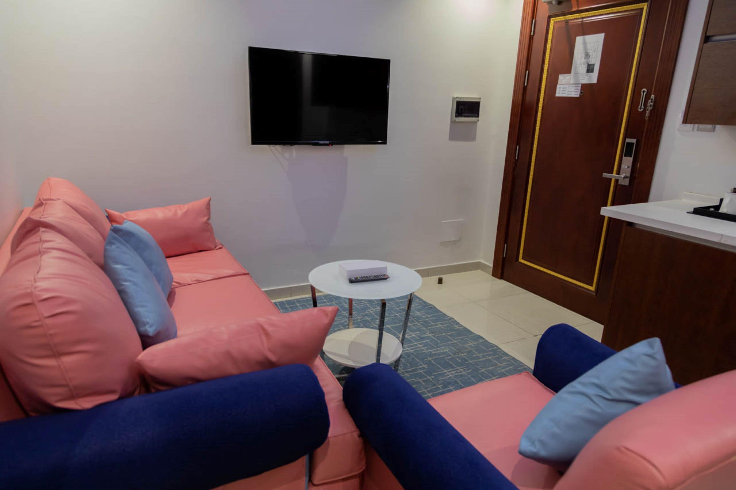 family suite | living area | 42-inch flat-screen tv with satellite channels, fireplace