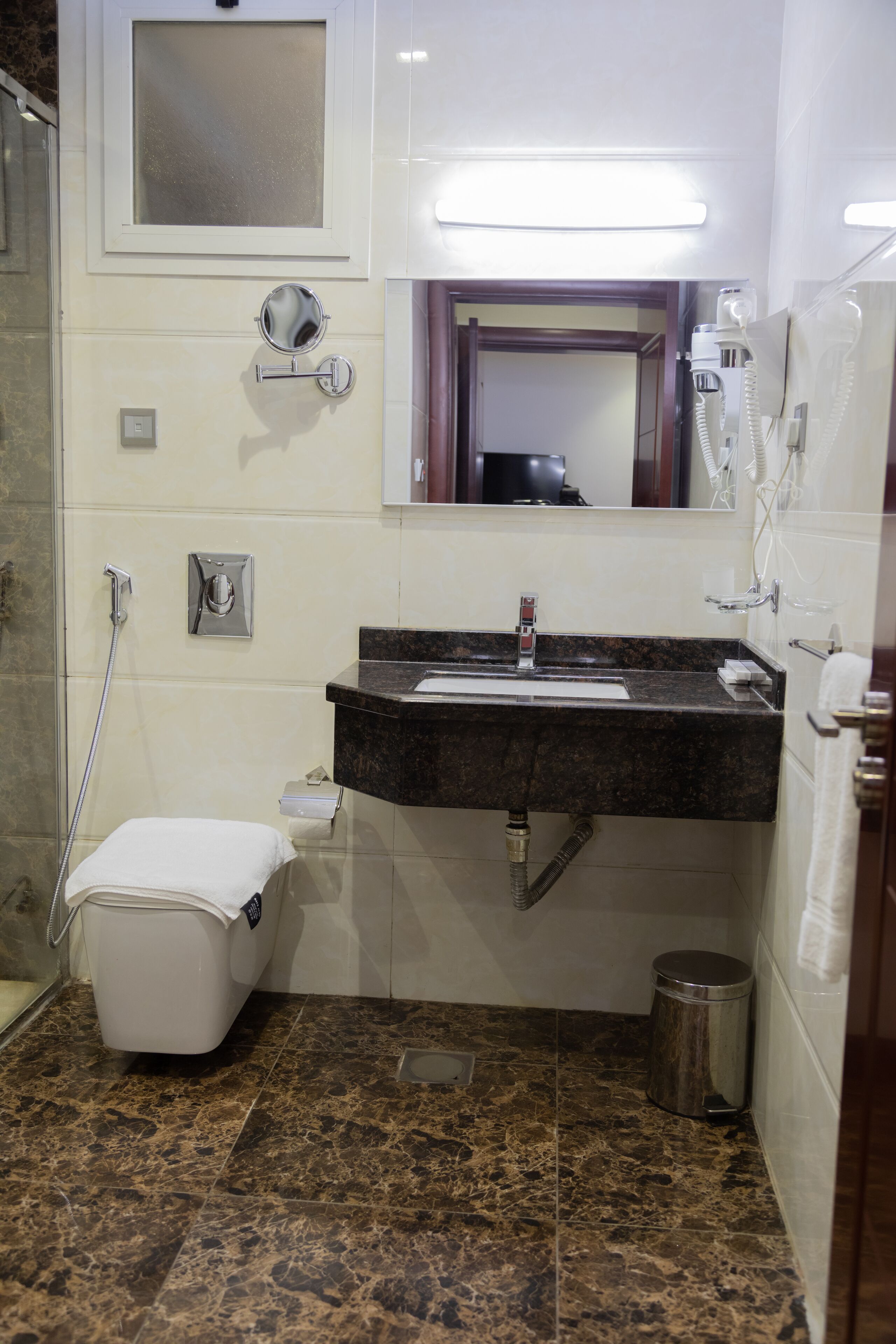 shower, designer toiletries, hair dryer, slippers