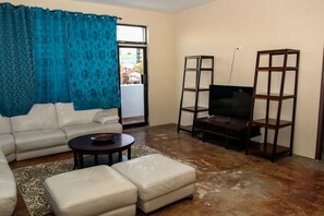 Deluxe Room | Living area | Flat-screen TV