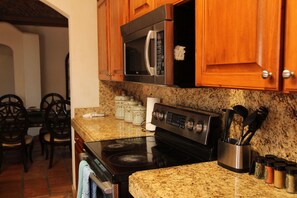 Deluxe Room | Private kitchen | Full-size fridge, microwave, stovetop, coffee/tea maker