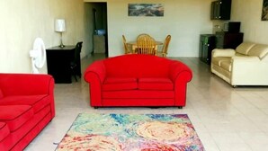 Chambre Deluxe | Coin séjour