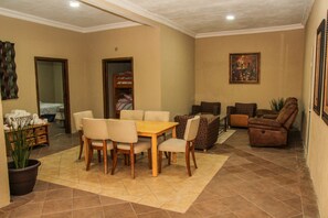 Deluxe Room | Living area | Flat-screen TV