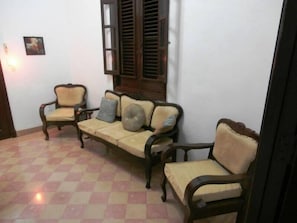 A room with a checkered floor, a sofa set, and a window with shutters. - Apto Havana Center Home (Havana)