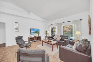 Flat-screen TV, DVD player, table football, toys