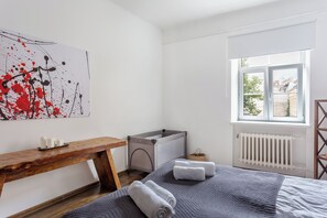 1 bedroom, desk, iron/ironing board, travel crib