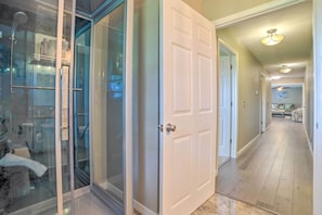 Enter a serene bedroom area through this elegant hallway.