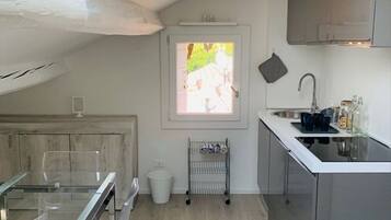 Fridge, coffee/tea maker, cookware/dishes/utensils