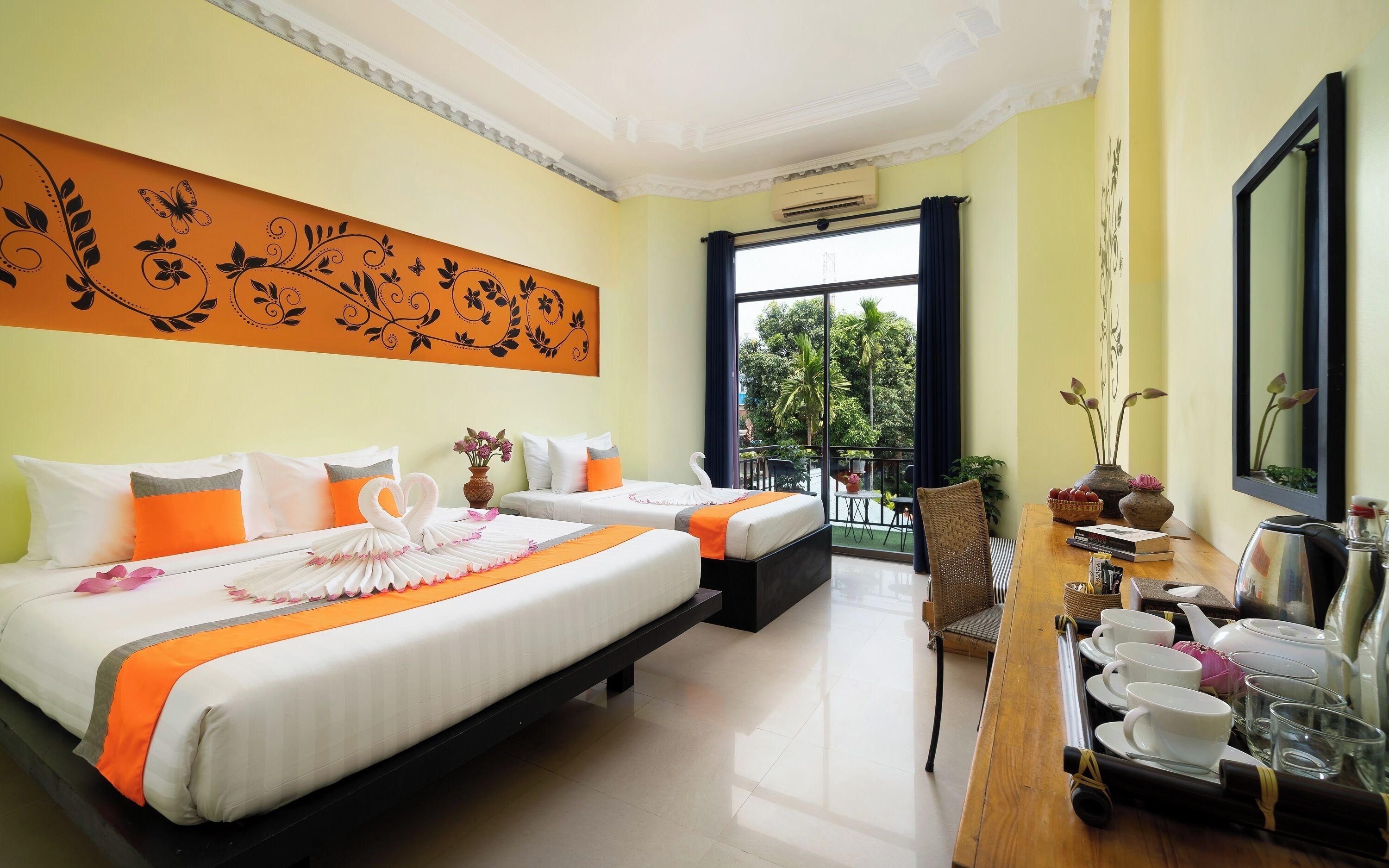 Deluxe Family Room with Balcony | Minibar, in-room safe, individually furnished, desk