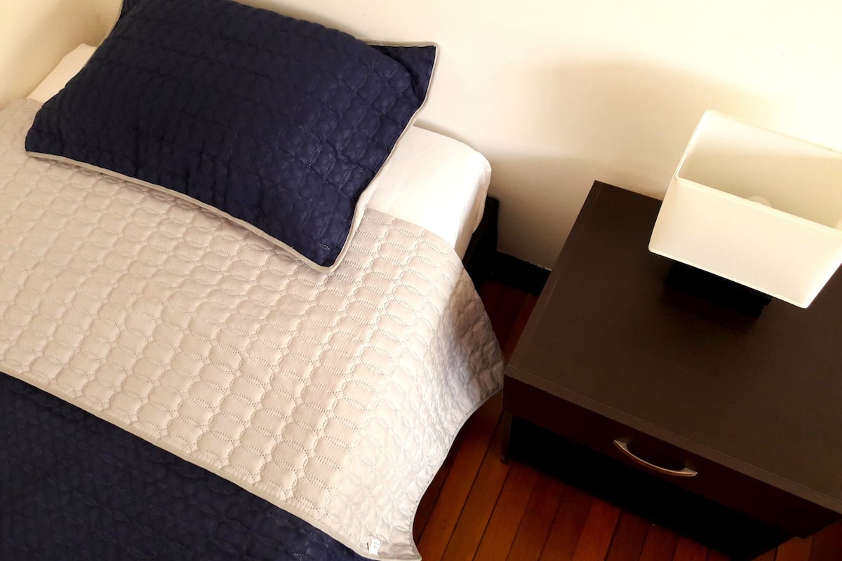 Premium bedding, down duvets, desk, laptop workspace