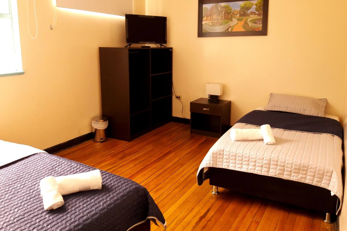 Premium bedding, down duvets, desk, laptop workspace