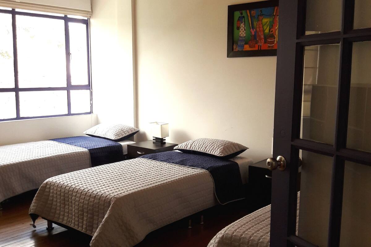 Premium bedding, down duvets, desk, laptop workspace