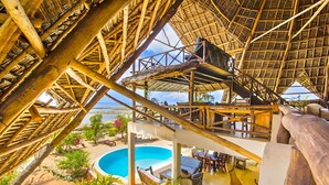 A multi-level wooden structure with a pool and outdoor seating area. - VILLA FUKU - Four Bedroom Villa, Sleeps 10 (Zanzibar)