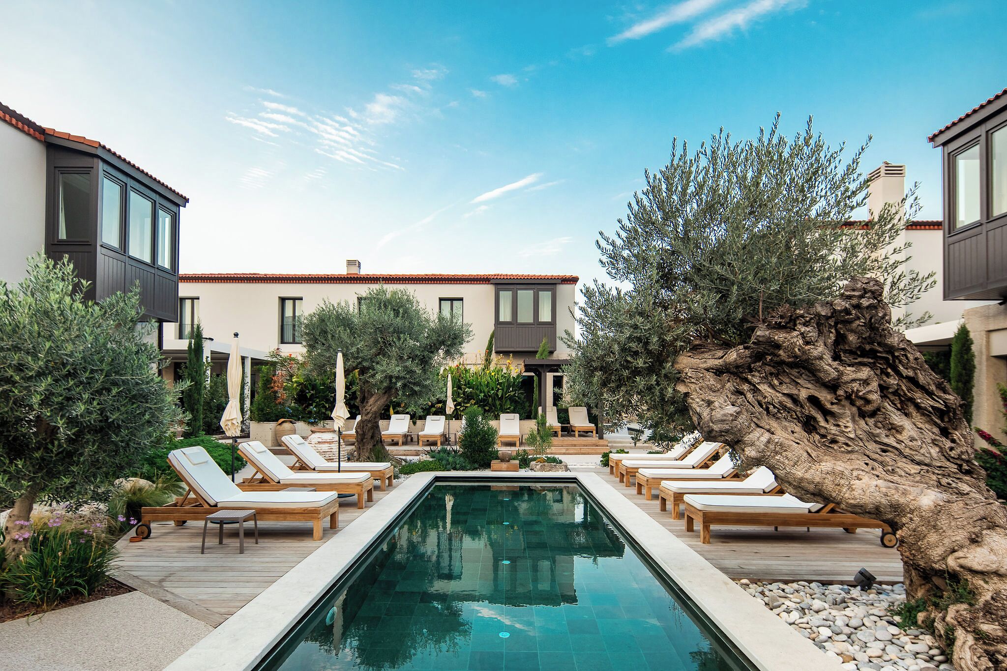 Seasonal outdoor pool, open 7:00 AM to 7:00 PM, pool umbrellas