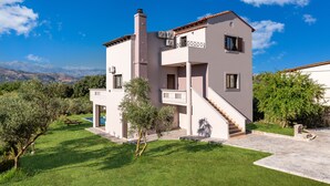 A modern two-story house with a balcony, a staircase, and a swimming pool in the background. - Views, Pool, Garden, BBQ, Playground, Tennis Table (CHANIA)