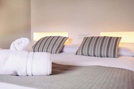 Premium bedding, down comforters, laptop workspace, blackout drapes. Hotel La Vera Cruz