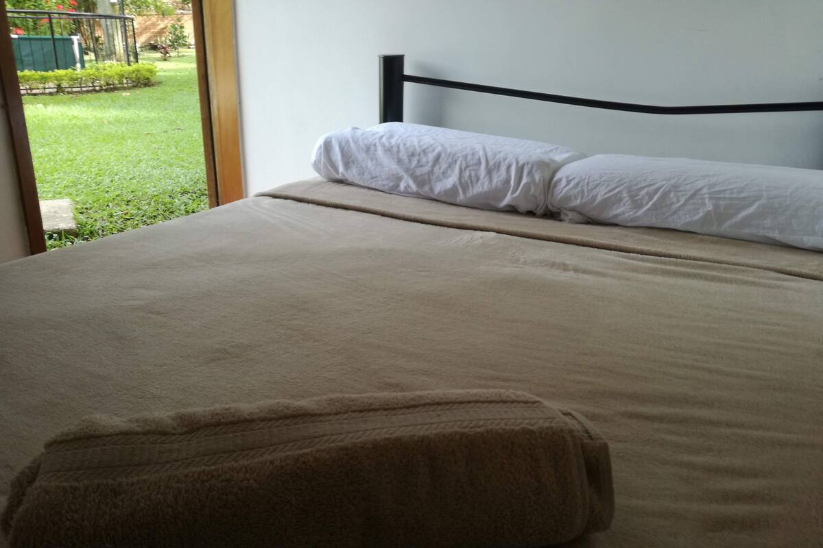 Premium bedding, laptop workspace, blackout curtains, iron/ironing board