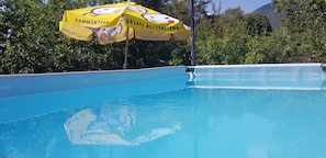 Seasonal outdoor pool, pool umbrellas, sun loungers