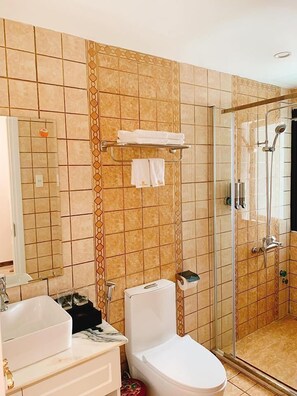 Shower, free toiletries, hair dryer, slippers
