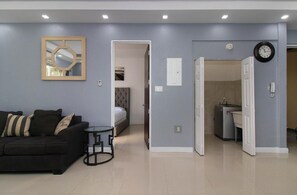 Luxury Apartment | Living area | 65-inch Smart TV with cable channels, TV - Barri Vacation Home (Kingston)