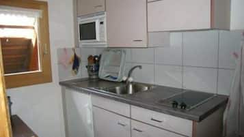 Fridge, microwave, highchair, dining tables