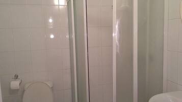 Shower, rainfall showerhead, hair dryer, towels