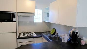 Microwave, coffee/tea maker, high chair, cookware/dishes/utensils