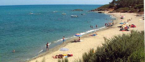 On the beach, sun loungers, beach towels