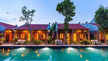 Deluxe Family Room | Front of property - evening/night