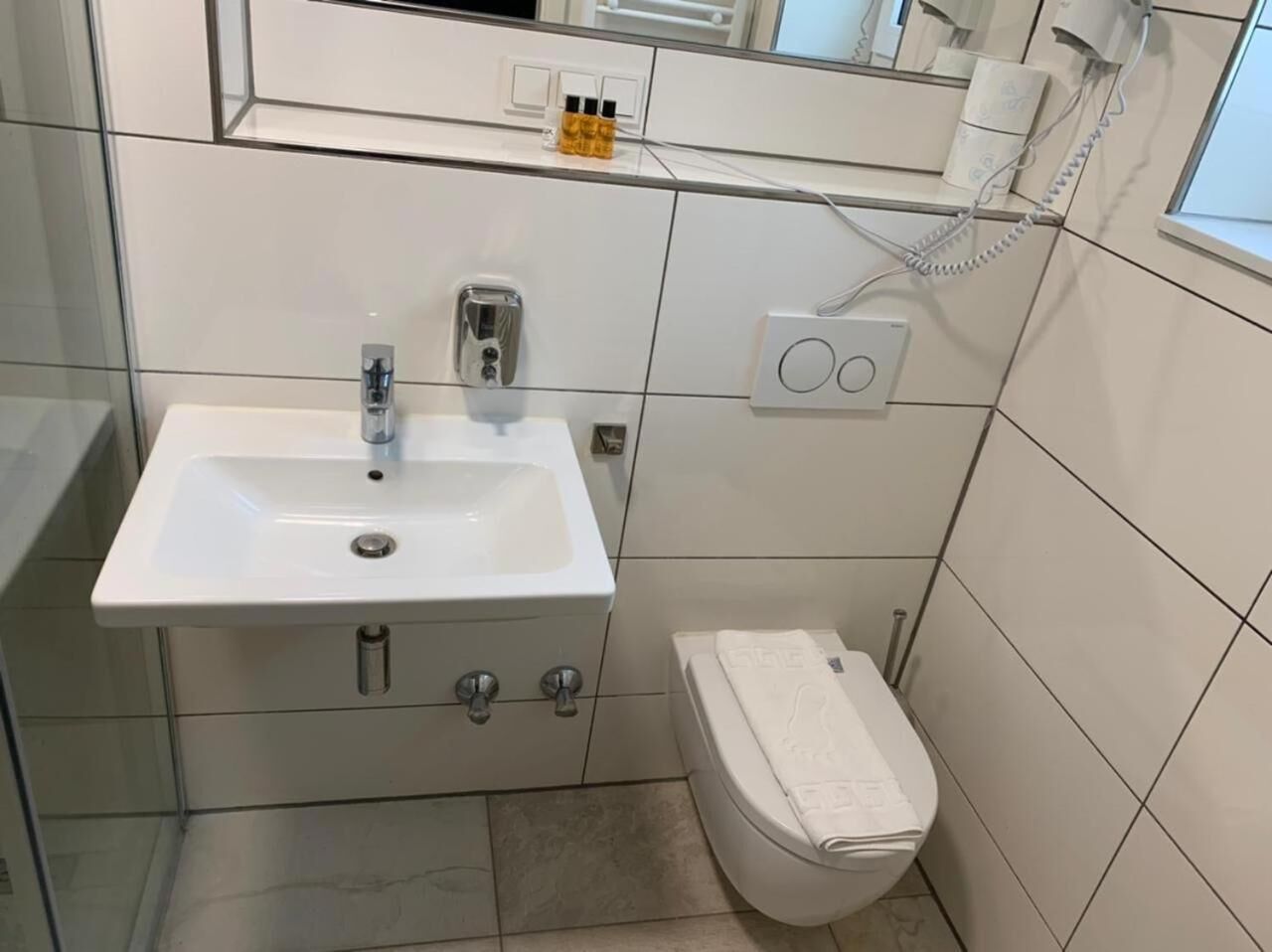 shower, rainfall showerhead, hair dryer, towels