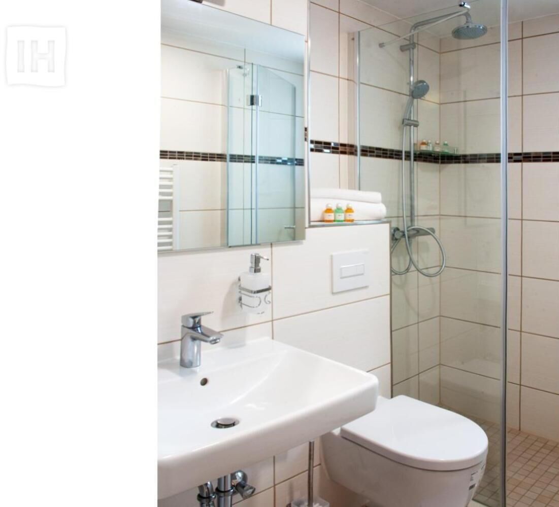 shower, rainfall showerhead, hair dryer, towels