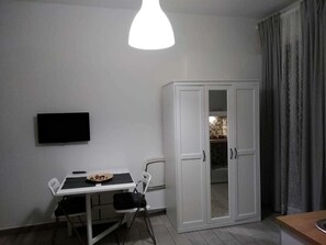 Deluxe Triple Room, Kitchenette (Ensuite) | Living area | 32-inch LED TV with cable channels, TV