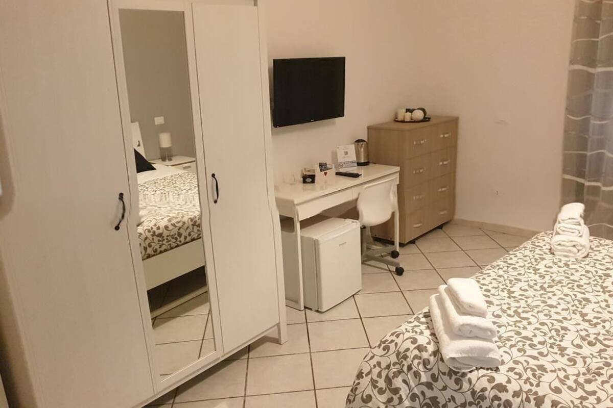 Basic Triple Room, Private Bathroom (External) | Desk, WiFi (free), bed sheets