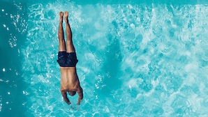 A person swimming in a pool.
