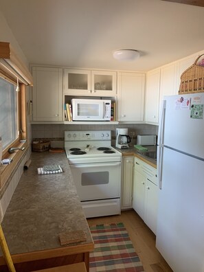 Microwave, coffee/tea maker, cookware/dishes/utensils